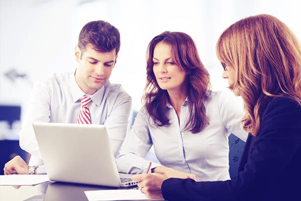 Advisors looking at computer