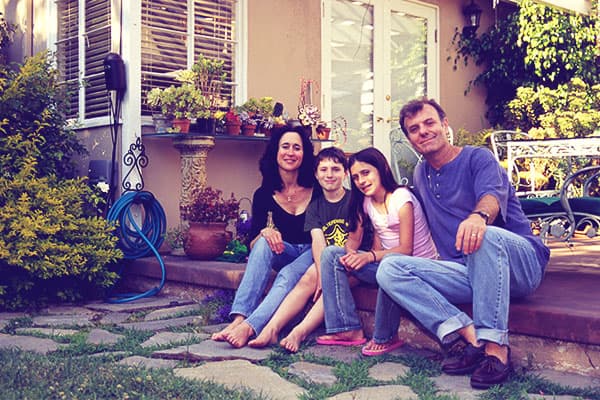 Happy family sitting on patio